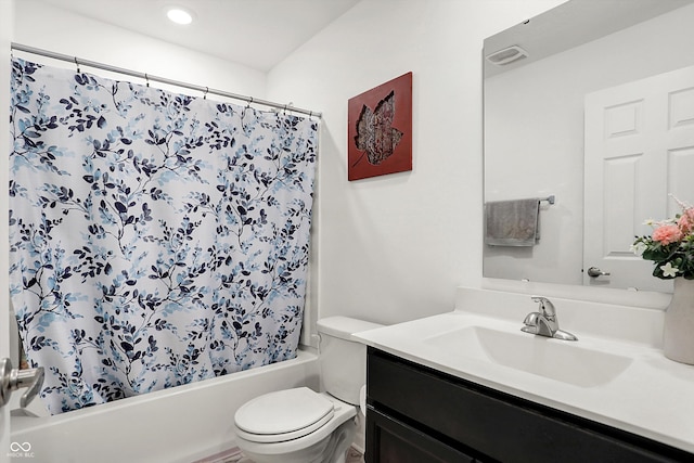 full bathroom featuring toilet, shower / tub combo with curtain, and vanity