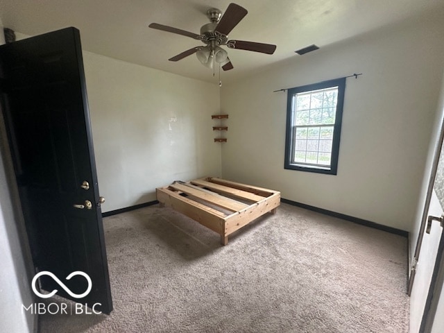 carpeted bedroom with ceiling fan