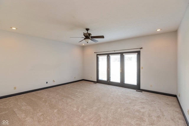 spare room with baseboards, a ceiling fan, carpet, french doors, and recessed lighting