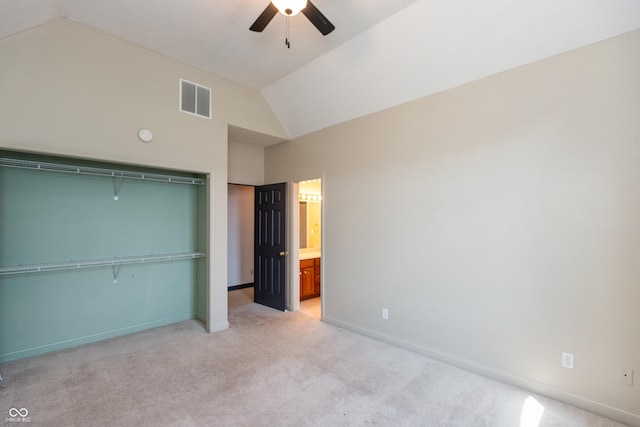 unfurnished bedroom with vaulted ceiling, baseboards, visible vents, and light colored carpet