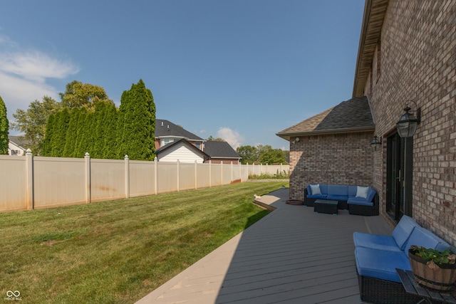 deck featuring a fenced backyard, an outdoor hangout area, and a yard