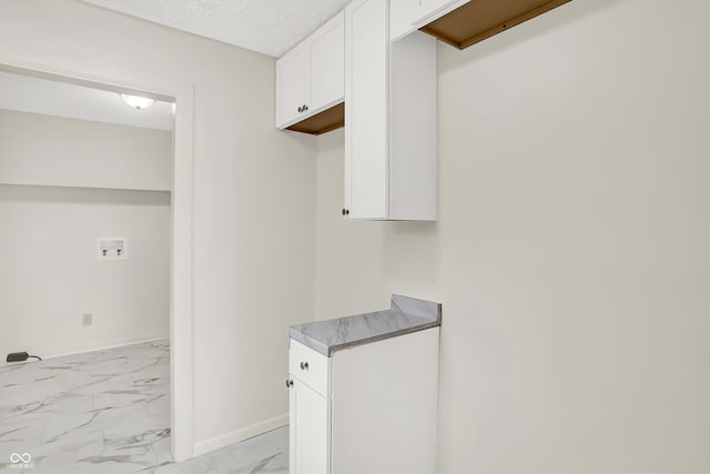 laundry room featuring a textured ceiling