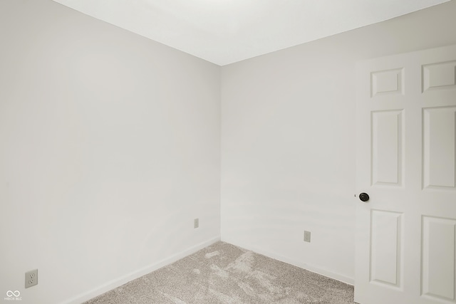 unfurnished room featuring light colored carpet