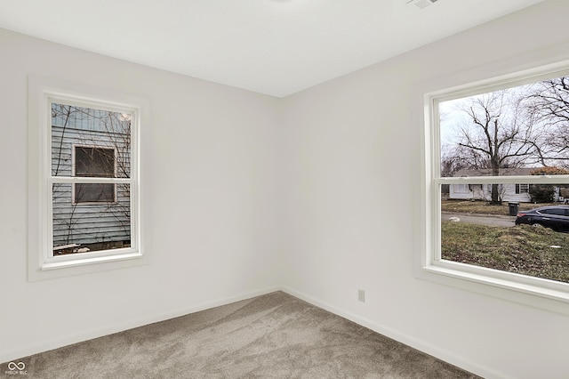 unfurnished room featuring carpet flooring