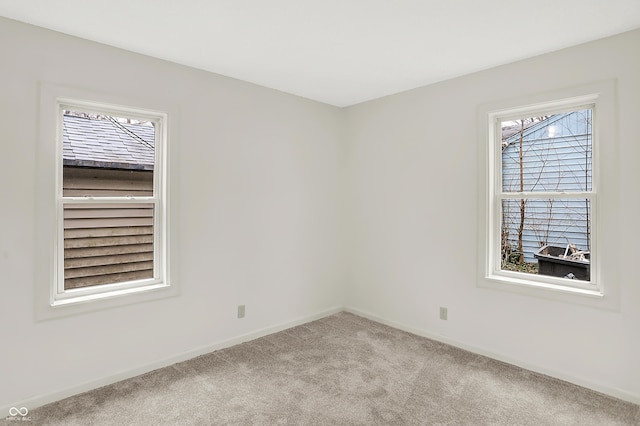 empty room featuring light colored carpet