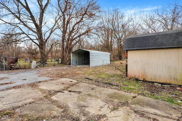 view of outbuilding featuring a carport