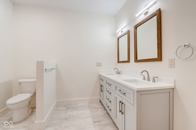 bathroom with toilet and vanity