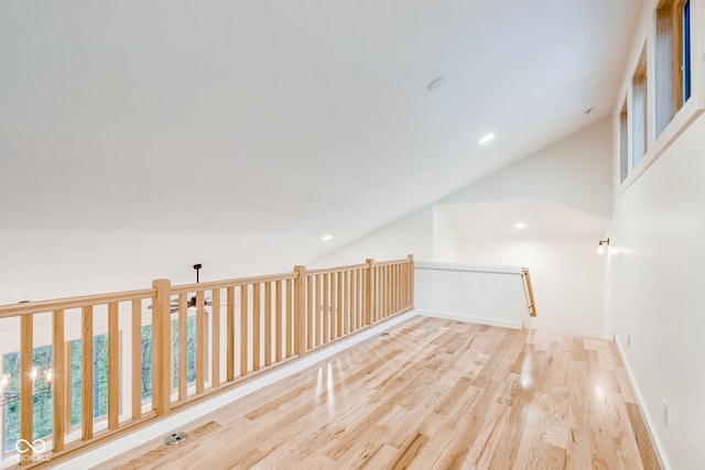bonus room with baseboards, vaulted ceiling, wood finished floors, and recessed lighting