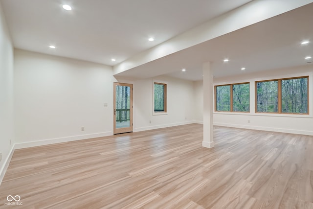 basement featuring recessed lighting, light wood-type flooring, and baseboards