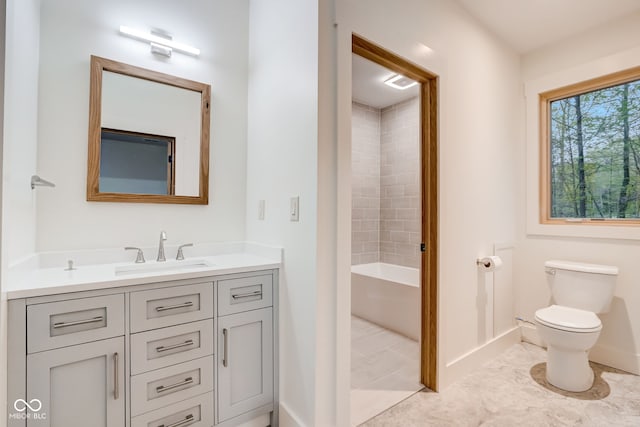 full bath with tile patterned flooring, baseboards, toilet, and vanity