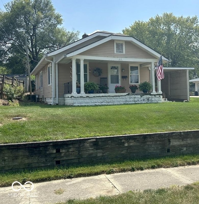 bungalow-style home with a front yard and a porch