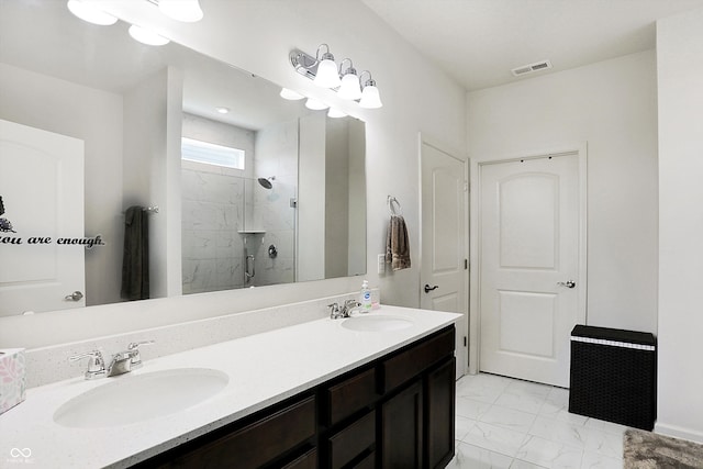 bathroom with vanity and a shower with shower door