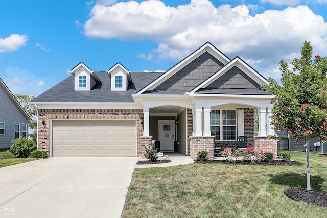 craftsman inspired home with a porch and a front lawn