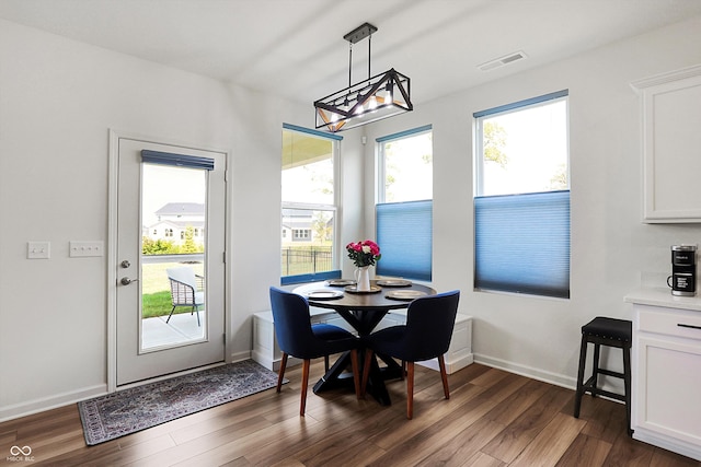 dining room with dark hardwood / wood-style floors