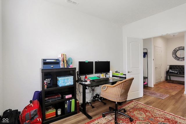 home office featuring hardwood / wood-style flooring