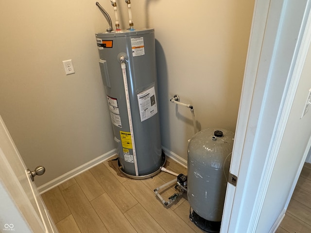 utility room featuring water heater