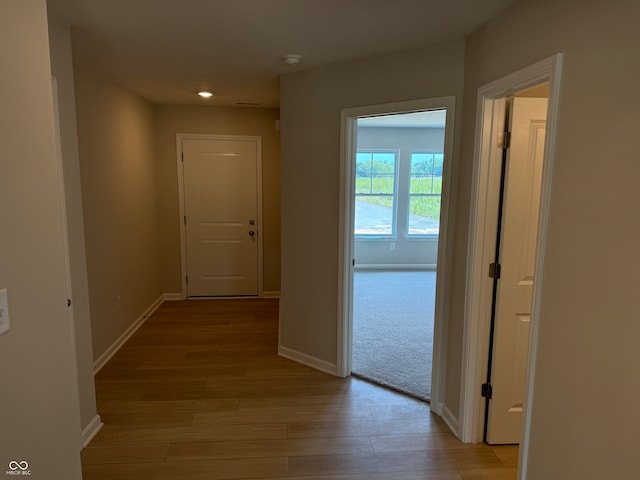 hallway with light wood-type flooring