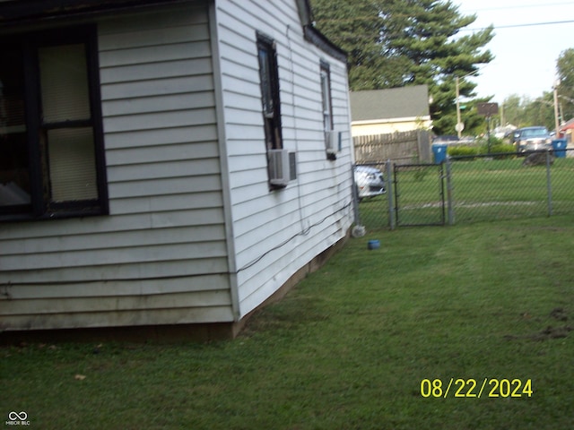 view of property exterior featuring a lawn