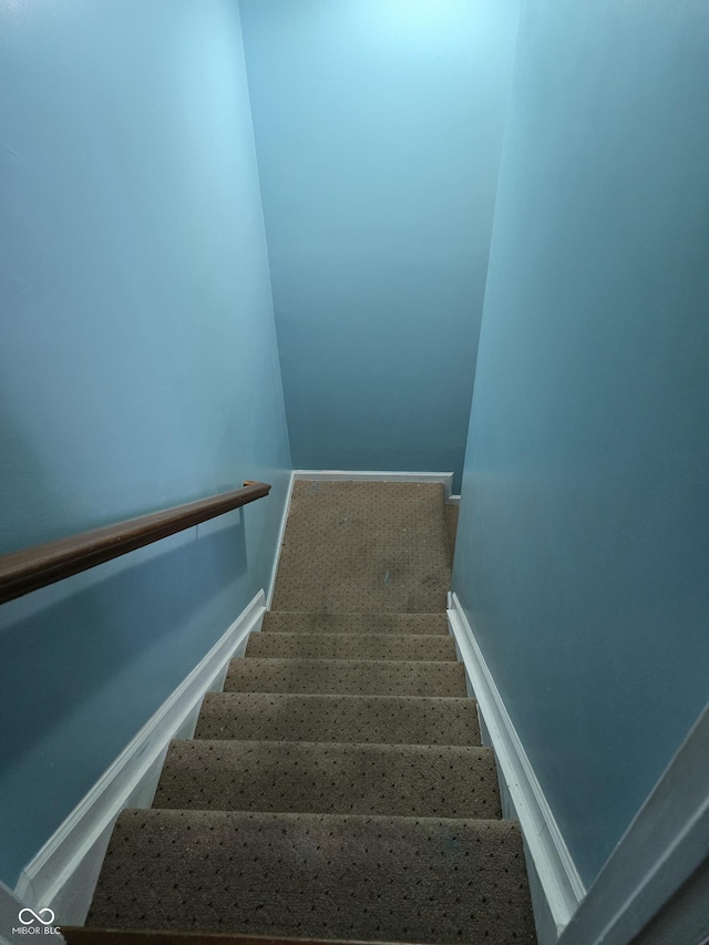 stairs featuring baseboards