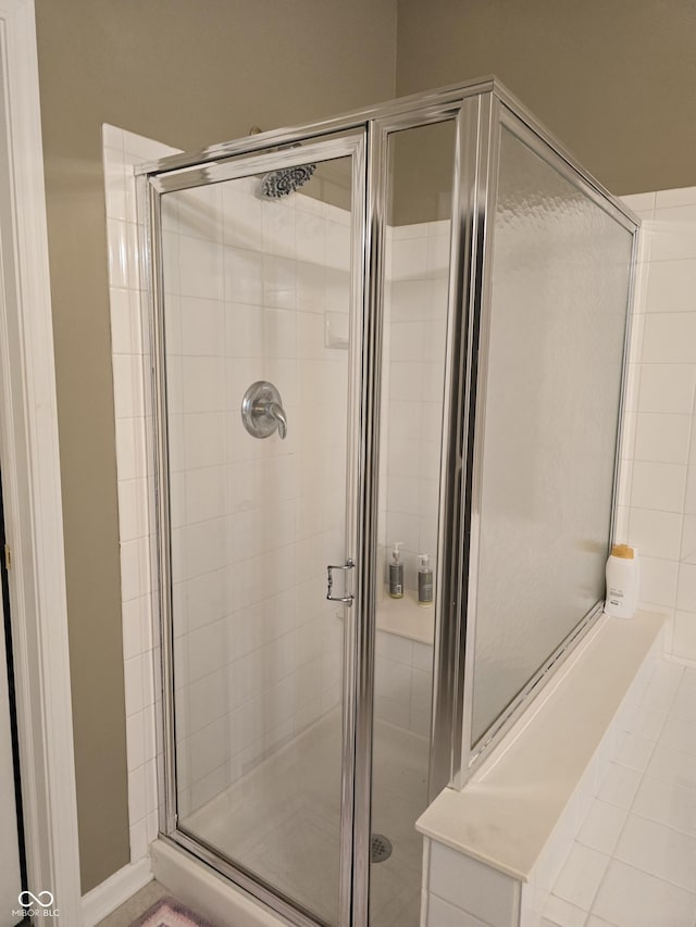 bathroom with a shower stall