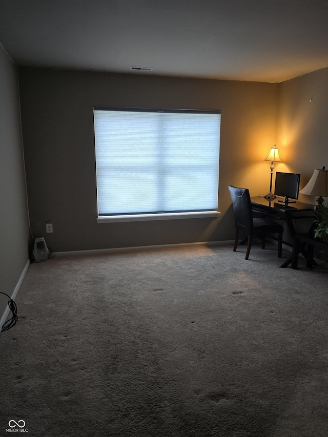 home office featuring visible vents and carpet