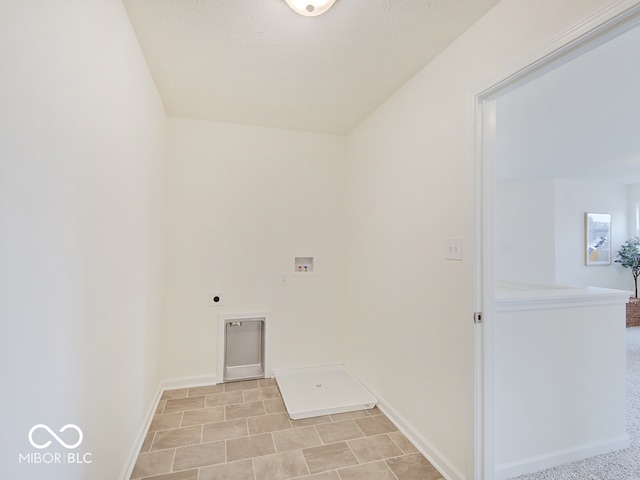 laundry room featuring laundry area, hookup for a washing machine, baseboards, and hookup for an electric dryer