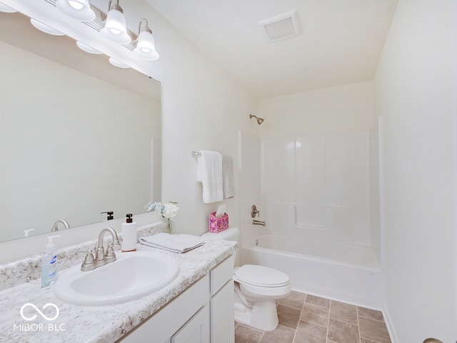 bathroom with washtub / shower combination, visible vents, vanity, and toilet