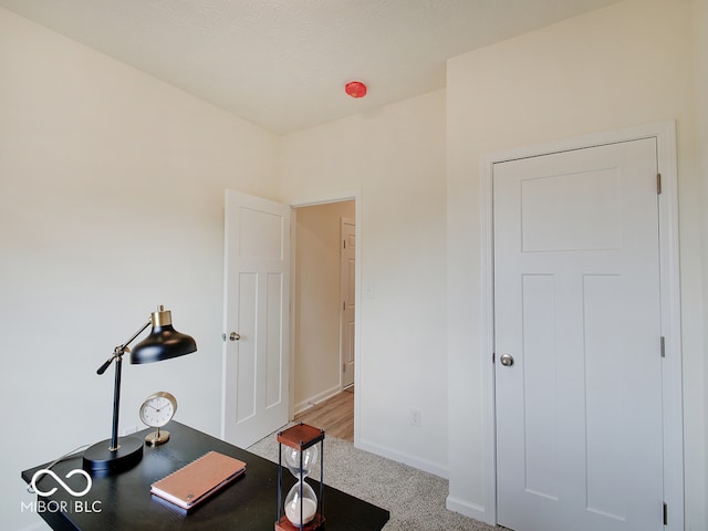 office area with carpet and baseboards