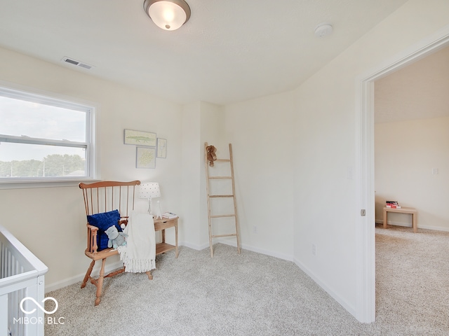 interior space with carpet flooring, visible vents, and baseboards