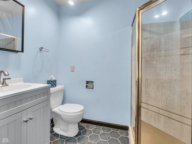 bathroom with toilet, a stall shower, tile patterned floors, and vanity