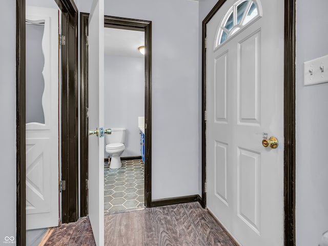 foyer entrance with dark hardwood / wood-style floors