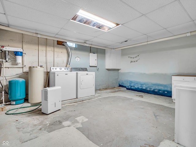 basement featuring a drop ceiling and independent washer and dryer