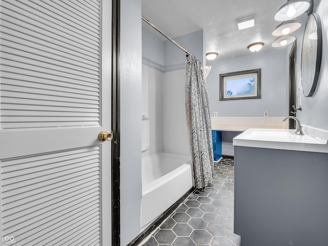 bathroom with shower / bath combination with curtain, tile patterned flooring, and vanity