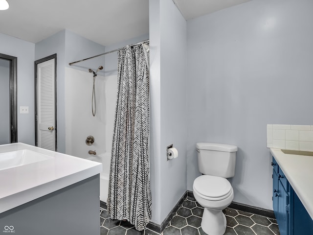 full bathroom with shower / bath combo, tile patterned flooring, toilet, and vanity