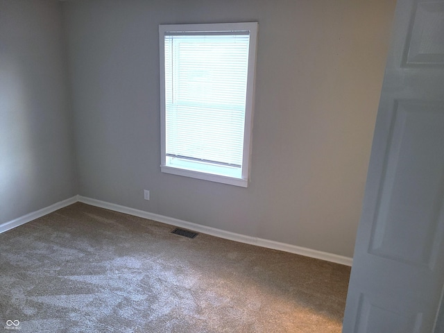 empty room featuring carpet flooring