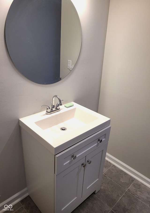 bathroom with tile patterned floors and vanity