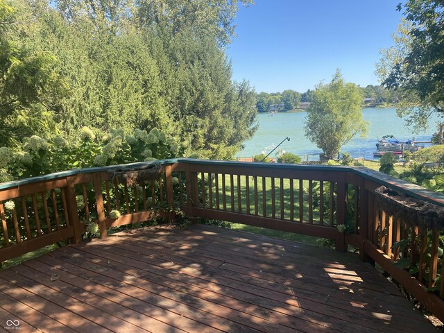 wooden deck featuring a water view