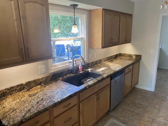 kitchen featuring dishwasher, pendant lighting, sink, and a healthy amount of sunlight