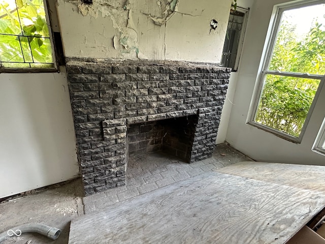 interior details with a brick fireplace