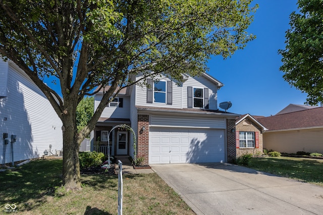 view of property featuring a garage and a front yard