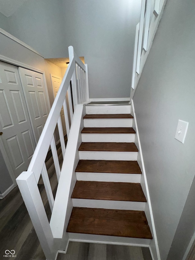 stairway with wood-type flooring