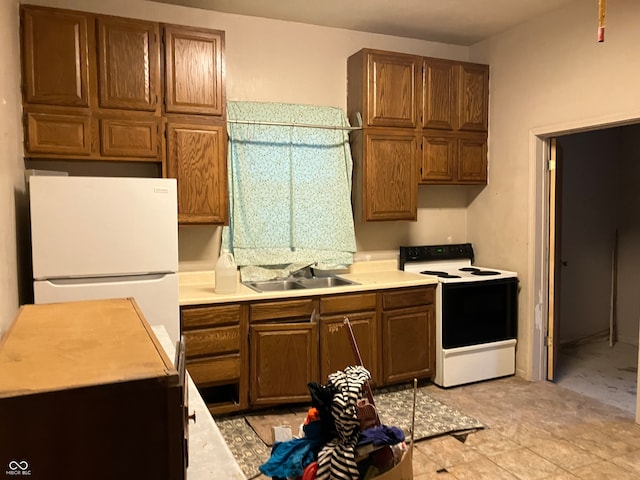 kitchen with sink and white appliances