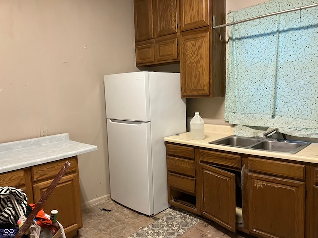 kitchen featuring sink and white refrigerator