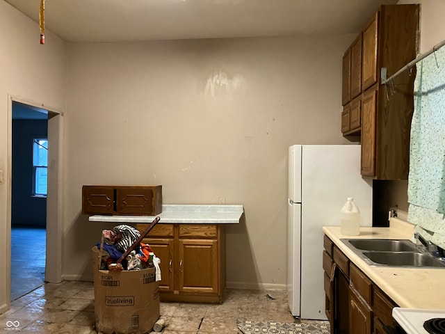 kitchen with white fridge and sink