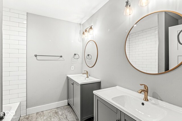 bathroom featuring vanity and hardwood / wood-style flooring