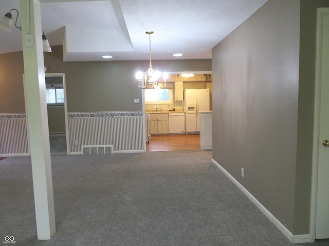 interior space featuring carpet flooring and a healthy amount of sunlight