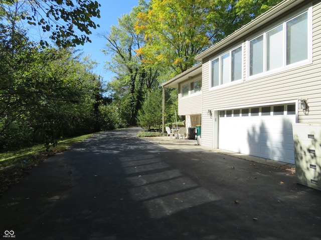 view of home's exterior with driveway