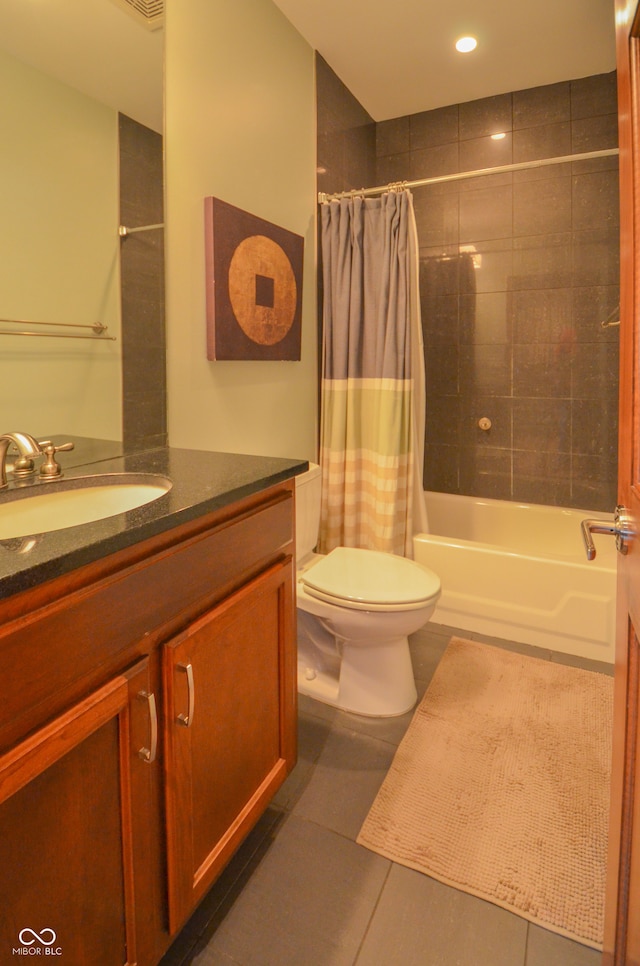 full bathroom with tile patterned flooring, toilet, shower / tub combo with curtain, and vanity