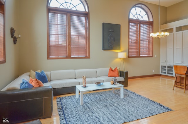 living room featuring a notable chandelier and hardwood / wood-style flooring