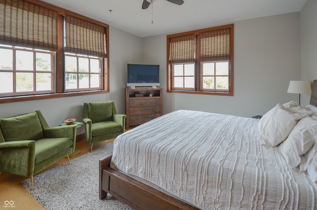 bedroom featuring hardwood / wood-style floors and ceiling fan